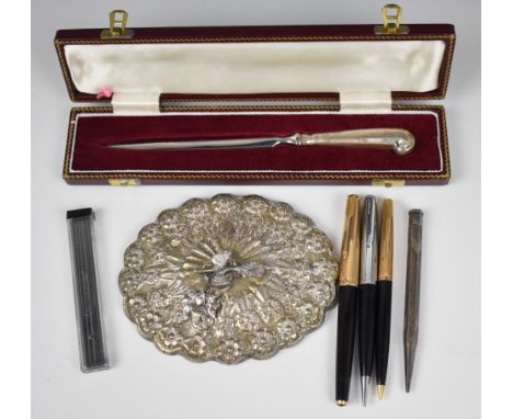 Middle Eastern or similar oval mirror with bird finial, maximum diameter 14cm, cased hallmarked silver handled paper knife or