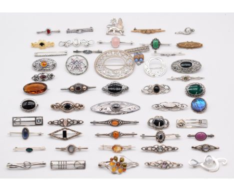 Forty seven silver brooches including butterfly wing, Celtic design, moonstone, pressed amber, hematite, marcasite, mother of