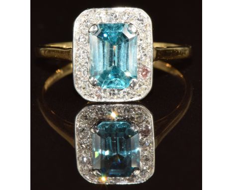 An 18ct gold ring set with an emerald cut zircon surrounded by diamonds, 3.2g, size R