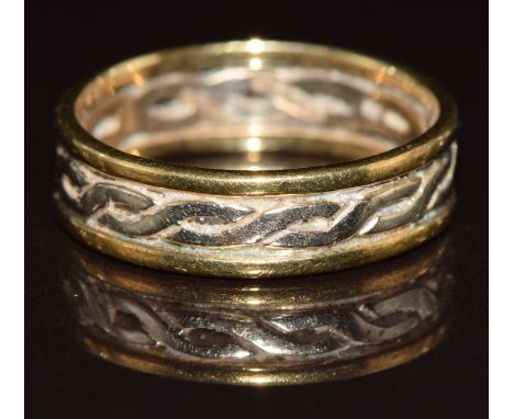 A 9ct gold bi-coloured ring with pierced Celtic design, 2.8g, size L