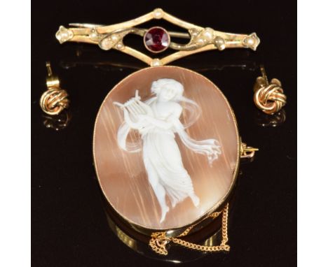 A 9ct gold brooch set with a garnet and seed pearls (2.1g), 9ct gold brooch set with a cameo depicting a lady with a harp (3 