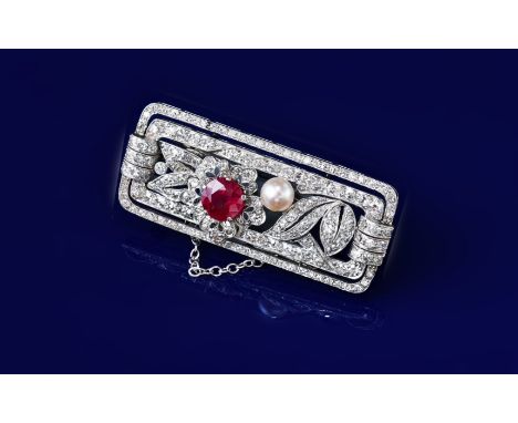 An Art Deco platinum brooch set with a round cut ruby of approximately 1.2ct, a natural pearl (5mm) and round cut diamonds, 1