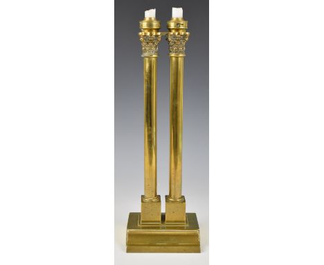 19th or early 20thC brass double column candlestick or candelabra, with spring loaded mechanism and bayonet fit caps or colla