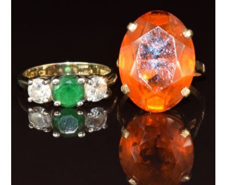 A 9ct gold ring set with paste and cubic zirconia (3g, size O), and a 9ct gold ring set with a citrine (5.5g, size J)