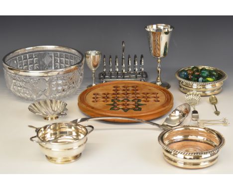 Silver plated items comprising cut glass bowl with plated rim, large soup ladle, twin handled bowl and a pair of wine bottle 
