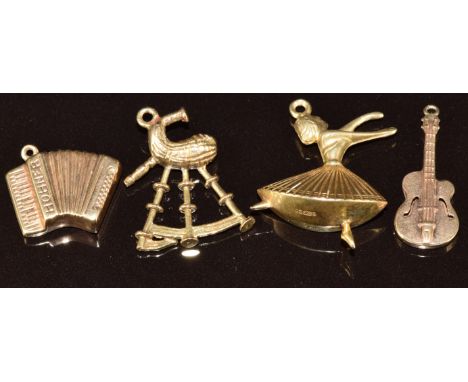 Four 9ct gold charms, a ballerina, guitar, Hohner accordion and bagpipes, 4.4g