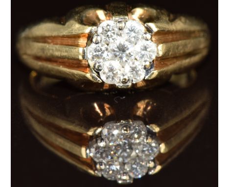 A 9ct gold ring set with diamonds in a cluster, 4.6g, size K