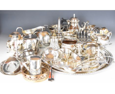 Silver plated ware including a large circular pierced tray, tea ware, gravy and sauce boats, candlestick, sifter, toast rack,