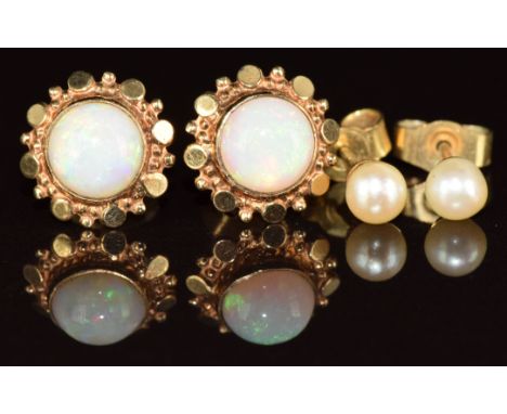 A pair of 9ct gold earrings each set with an opal cabochon and a pair of 9ct gold earrings each set with a pearl, 2g