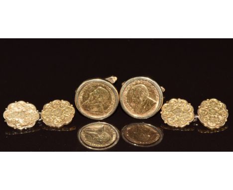 A pair of 9ct gold cufflinks each set with a 1/10 Krugerrand (11.7g) and another pair of yellow metal cufflinks with engraved