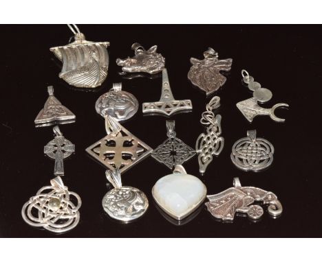 Sixteen silver pendants including Celtic examples, 150g&nbsp;
