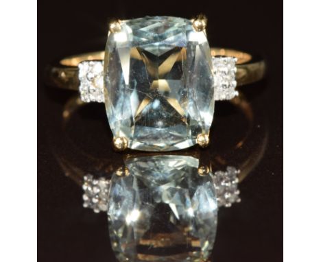 A 9ct gold ring set with a mixed cut aquamarine and diamonds, 3.4g, size P