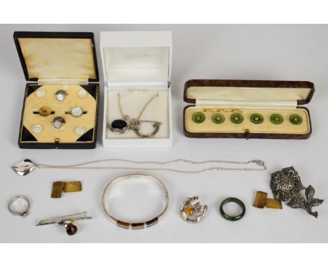 A collection of silver including&nbsp;bangle set with tiger's eye, brooch set with marcasite, two WBs thistle brooches, ring 