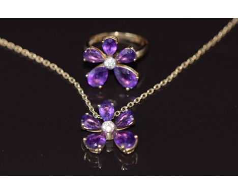 A 9ct gold ring set with amethysts and diamonds, with matching pendant on 9ct gold chain, 6.7g
