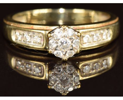 A 9ct gold ring set with diamonds in a cluster, 2g, size L