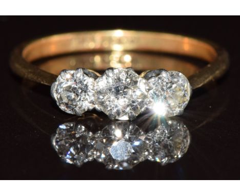 An 18ct gold ring set with three diamonds of approximately 0.35ct, 0.2ct &amp; 0.2ct, 2.7g, size P