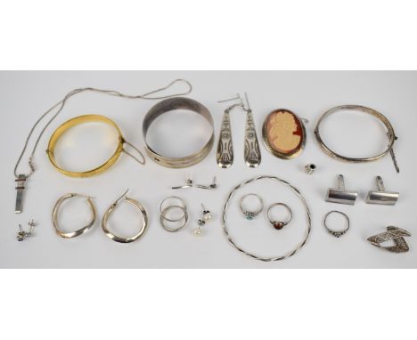 A collection of silver jewellery including five rings, Charles Horner bangle, two further bangles, four pairs of earrings, cu