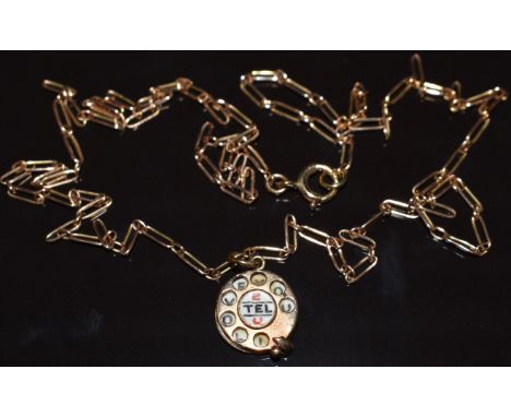 A 9ct gold charm/ pendant in the form of a telephone set with enamel reading '2 tel U I love you' on 9ct gold chain, 6.1g, 52