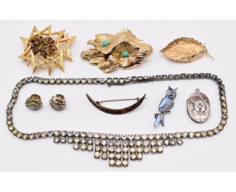 A collection of jewellery including Christian Dior brooch, Exquisite brooch set with tiger's eye, Grosse brooch 1967, silver 