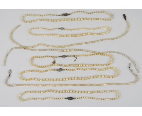 Eight strands of cultured pearl necklaces, four with silver clasps&nbsp;