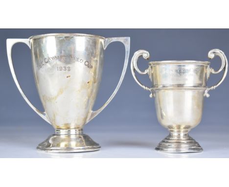 Two George V hallmarked silver twin handled trophy cups, one Mappin &amp; Webb, Sheffield 1939, engraved Macintyre Cup Kharto