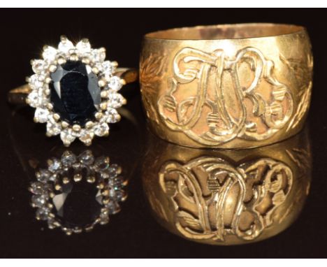 A 9ct gold ring set with a sapphire and cubic zirconia and a yellow metal ring set with initials, 7g, size R &amp; I