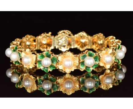 An 18ct gold bracelet made up of floral links, each set with a pearl, and alternating links set with green enamel, 31.9g, 18.