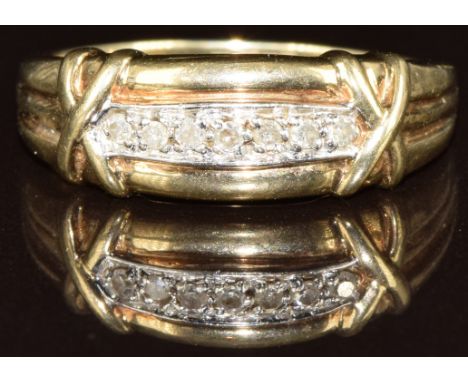 A 9ct gold ring set with diamonds, 3.7g, size R