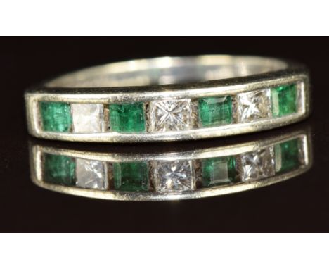 A 9ct white gold half eternity ring set with emeralds and princess cut diamonds, 2.7g, size N