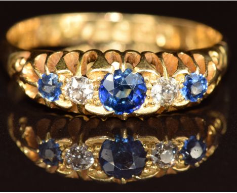 Edwardian 18ct gold ring set with three sapphires and diamonds, Chester 1903, 3.7g, size Q/R