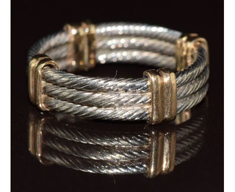 A 9ct gold bi-coloured ring made up of three rope twist rings and yellow gold spacers, 5g, size J