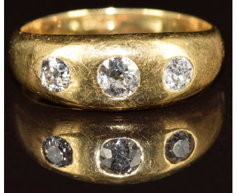 An 18ct gold ring set with three old cut diamonds, the larger approximately 0.25ct, 7.2g, size R