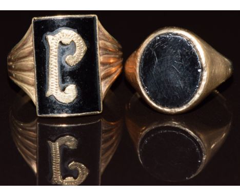 Two 9ct gold signet rings set with onyx, 8.5g, size L &amp; R