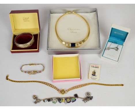 Christian Dior necklace in original box, silver bangle, silver charm bracelet with enamel shield charms, silver gilt bracelet