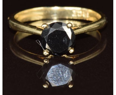 An 18k gold ring set with a round cut black diamond of approximately 1ct, 2.3g, size L