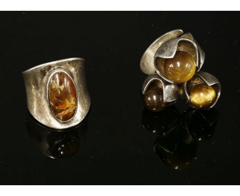 A sterling silver Finnish three stone tiger's eye ring by Solovair Turku (1950 -1988),three graduated tiger's eye beads, in s