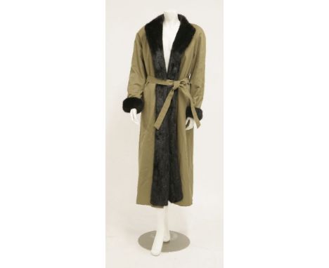 An Aquascutum long-haired black Russian mink lined mackintosh coat, with wrap-around belt, label to the inside of the pocket,