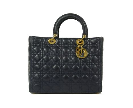A Christian Dior 'Lady Dior' navy lambskin leather quilted handbag,with Cannage topstitching hard top handles, gold-tone hard