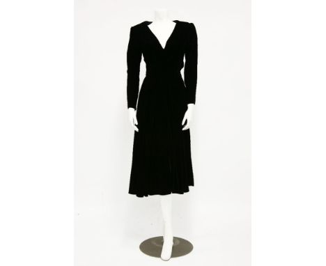 A vintage black silk velvet evening dress,c.1970s, with 'V' shaped neckline and tapering sleeves, approximately size 10, anda