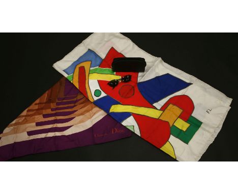 A pair of Ray-Ban sunglasses,black tinted lenses with black frames,together with a Christian Dior purple silk scarf,with pink
