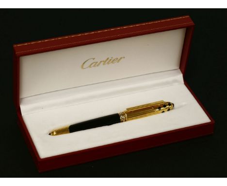 A Cartier gold-plated Pasha fountain pen,with black lacquer barrel, fluted end and cap decorated with black lacquer scattered