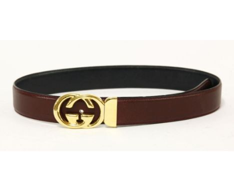 An Etro vintage belt,brown metallic leather with paisley printed plastic belt in box, anda Gucci burgundy red leather belt,wi