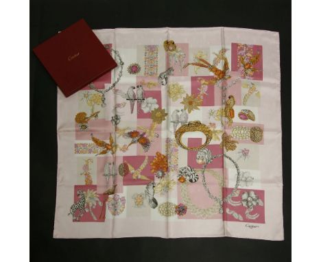 A Cartier silk 'Precious Fauna and Floral' scarf,a pink and cream ground with printed jewellery designs, in a red Cartier box