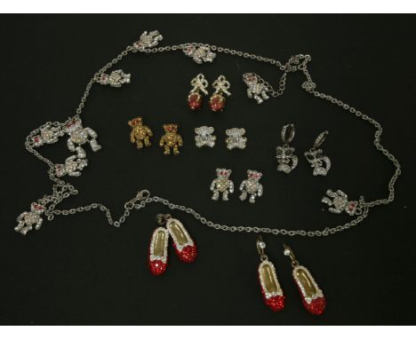 A Butler and Wilson two-row chain necklace,with assorted cubic zirconia teddy bear charms,a pair of red cubic zirconia 'Dorot