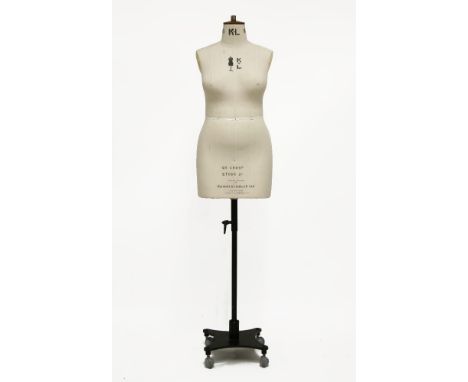 A Kennett and Lindsell female dressmaker's mannequin,covered in the maker's classic cream linen with adjustable shoulders, ma