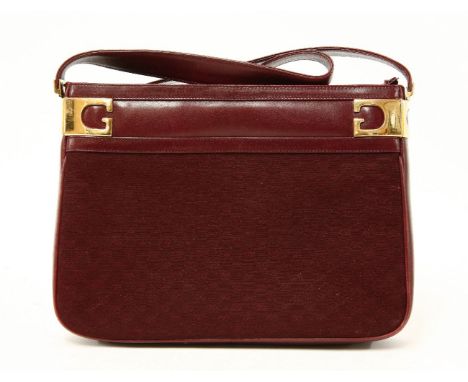 A Gucci vintage red leather and canvas shoulder handbag,with monogrammed double 'G' canvas, gold-tone hardware and sectioned 