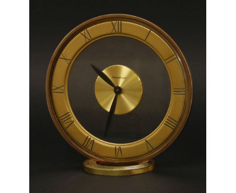 A Jaeger-LeCoultre desk timepiece,mid-20th century, gilt metal Roman numeral chapter ring arranged between two circular glass