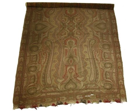 A Kashmiri wedding woven wool shawl,early 19th century, woven throughout with palmettes and scrolls on a red background withi