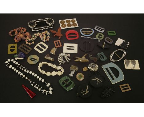 A collection of costume jewellery,an Art Deco early plastic green and metallic buckle, a selection of Art deco and later dres