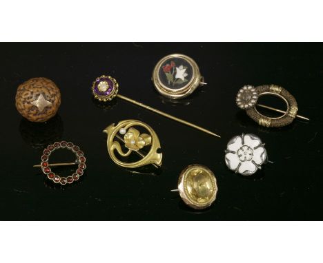 An American Art Nouveau gold brooch,with a split pearl to the central flower and to one side, marked as CXK,a Georgian woven 